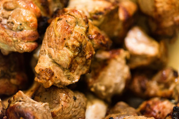 Pieces of tasty roasted meat close up