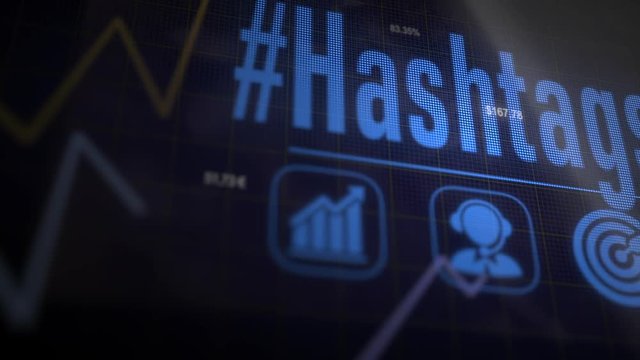 A Hashtags business concept on a flashing computer monitor with moving graphs and data.