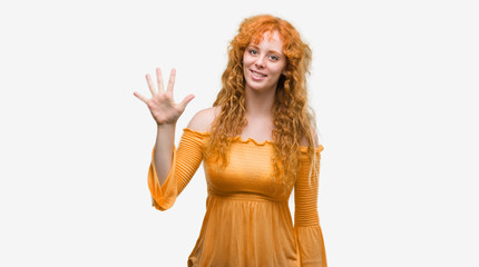 Young redhead woman showing and pointing up with fingers number five while smiling confident and happy.