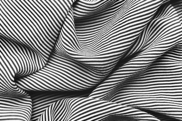 Elegant black and white striped silk with waves, background texture