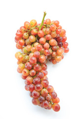 Ripe red grape. Pink bunch isolated on white.