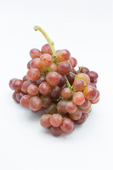 Ripe red grape. Pink bunch isolated on white.