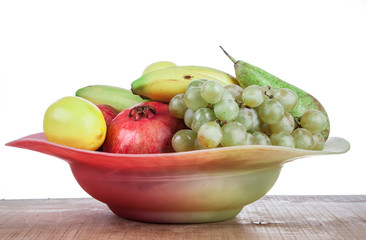 pomegranates and other fruits in a bowl