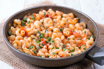 Pasta with tomato sauce in a frying pan