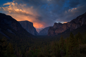 Half Dome rock climbing summits in beautiful golden  light at sunset in summer, Yosemite National Park, California, USA