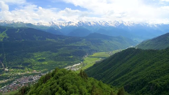 panoramic aerial view of mountain with cloud and town in valley