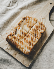 Toast with Sweetened condensed milk on a cutting board