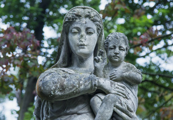 Fototapeta premium Queen of Heaven. Ancient statue of the Virgin Mary with Jesus Christ (Christianity, religion, faith, God concept)
