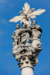 Fototapeta na wymiar Holy Trinity statues in front of the Ursuline Church of the Holy Trinity in Ljubljana, Slovenia, created by Francesco Robba in 1722.