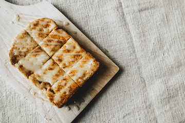Toast with Sweetened condensed milk on a cutting board