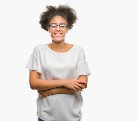 Fototapeta na wymiar Young afro american woman wearing glasses over isolated background happy face smiling with crossed arms looking at the camera. Positive person.