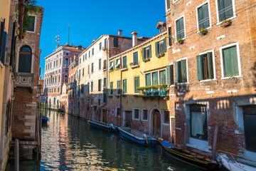 Fototapeta na wymiar boats in the narrow canals of Venice, Italy