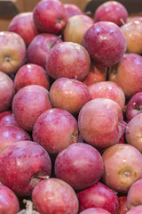 Red apples for backgrounds. Red apples background at departmental store. vertical photo.