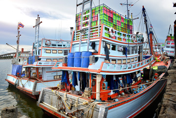 Fototapeta na wymiar Fishery boats're mooring at the harbour