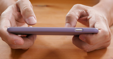 Man plays with cellphone