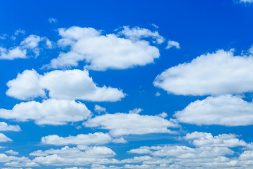 White fluffy clouds in deep blue sky
