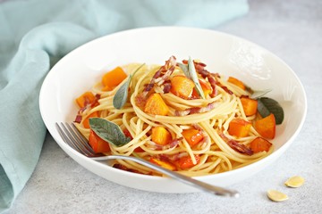 Pumpkin pasta. Spaghetti with roasted pumpkin, crispy bacon strips and sage liaves. 