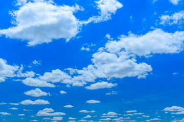 White fluffy clouds in deep blue sky