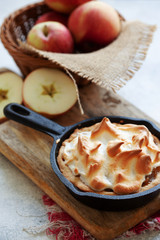Homemade apple meringue pie in cust iron fry pan