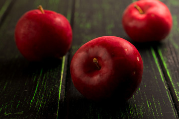 Apples on rustic wooden desk. Autumn season. Harvest.