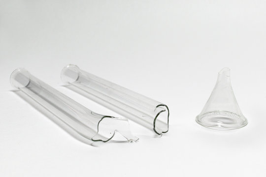 U-bent Absorption Tube, Broken In Half, And Small Glass Funnel Without Stem. Old Ruined Laboratory Glassware