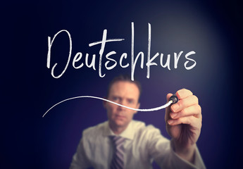 A businessman writing a German Course 