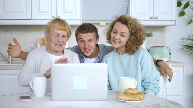 Grandmother And Grandchildren Having Video Call Using Laptop Computer.