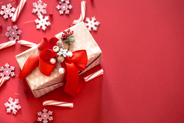 Christmas concept, gift box with decor on red background
