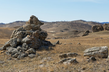 Fototapeta na wymiar The stone like a mouse in Tazheranskie steppes in Irkutskaya oblast near Baikal lake