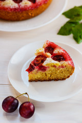 Slice of plum pie on a plate