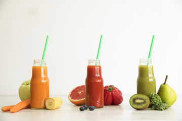Composition of healthy detox juices and smoothies with seeds. Healthy vegetables and fruits on the white background, copy space