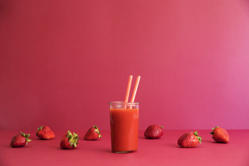 Healthy red smoothie with red strawberry fruit lie on the table. Detox diet for healthy body and mind.