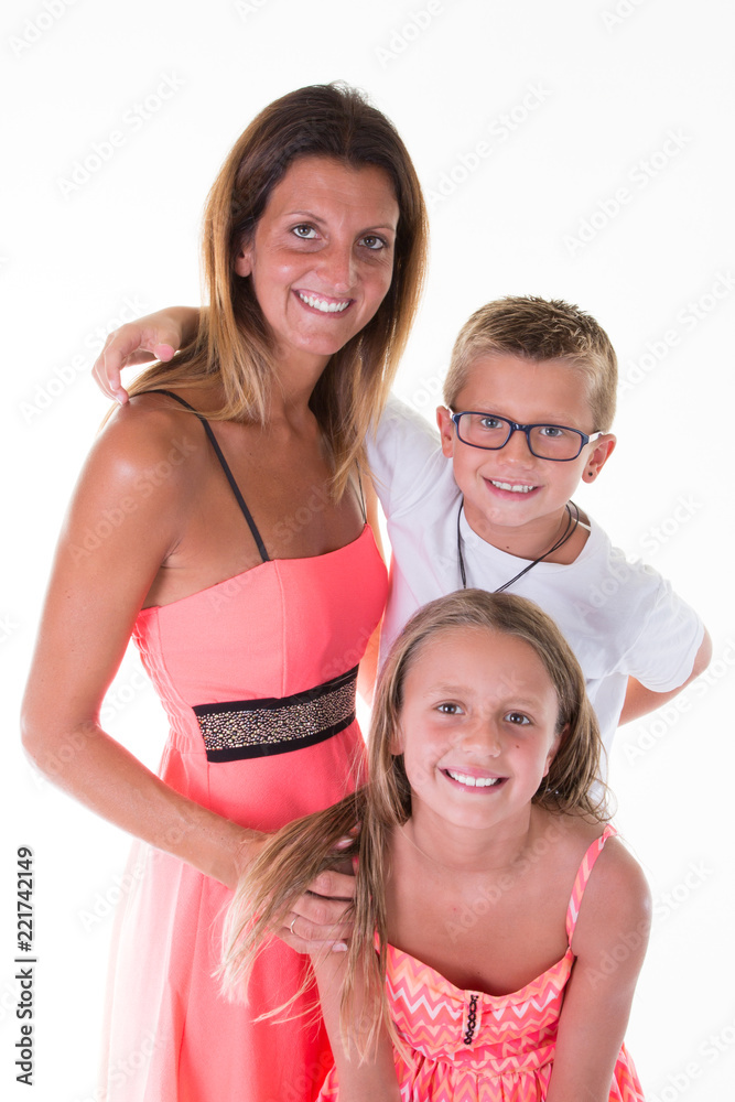 Wall mural happy young family with two children smiling posing at camera isolated on white