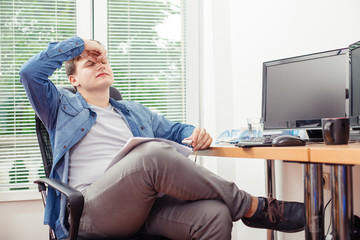 Man feeling stressed after hard work