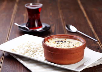 traditional turkish milk and rice desert with tea