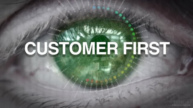 Close up of an eye focusing on Customer First concept on a futuristic screen.