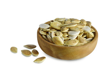 Bowl of pumpkin seeds isolated on white background