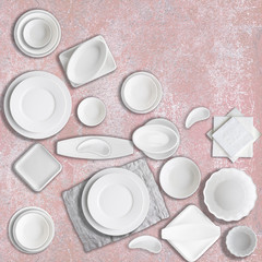 Different white porcelain dishes set on pink stone background. Concept of cooking, food,...