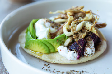 Tortilla with avocado, fresh cheese, beetroot and oyster mushrooms