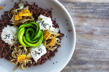 Delicious dish with Avocado, cheese, corn and sprouted wheat grains.