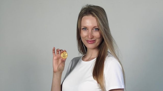 Pretty blond positive Woman With Bitcoin coin