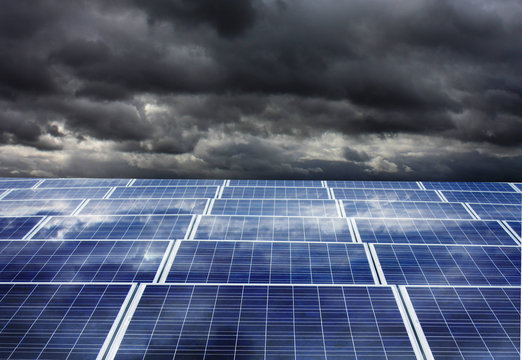 Photovoltaic panels under dark clouds before the storm
