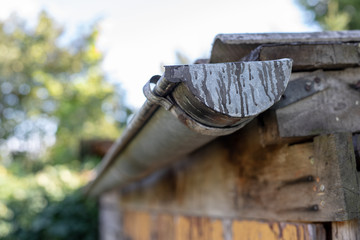 Gutter draining rainwater. The building is equipped with drainage of rainwater from the roof.