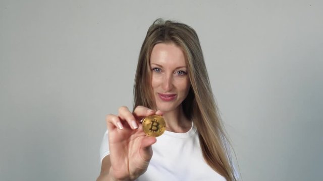 Pretty blond positive Woman With Bitcoin coin