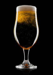 Cold glass of lager beer with foam and bubbles