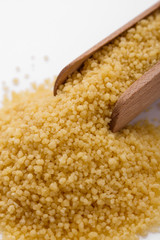 fresh couscous on a white acrylic background