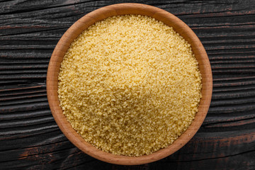 fresh couscous on a wooden rustic background