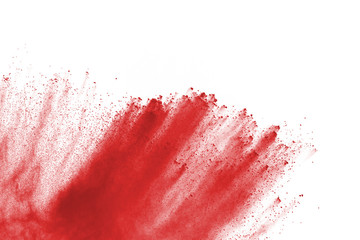 Freeze motion of red powder exploding, isolated on white background. Abstract design of red dust cloud. Particles explosion screen saver, wallpaper