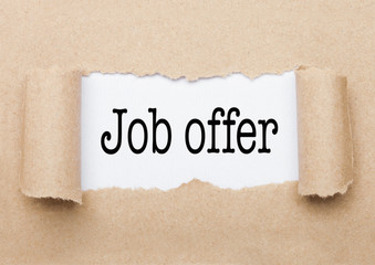 Job Offer text appearing behind torn brown paper