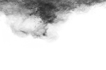 particles of charcoal on white background,abstract powder splatted on white background,Freeze motion of black powder exploding or throwing black powder.